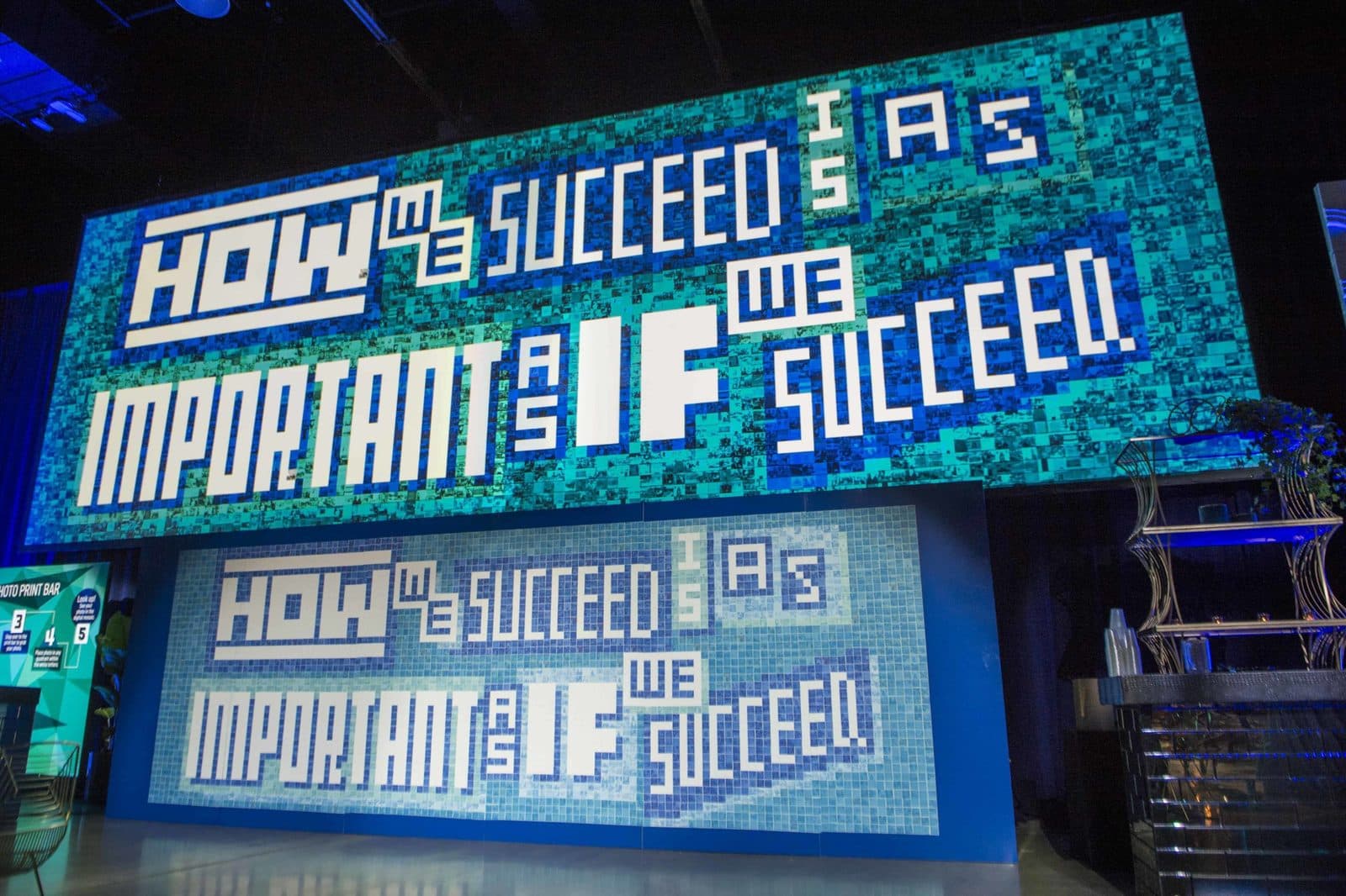 Baird 100 Years live photo mosaic on the stage wall at the company celebration