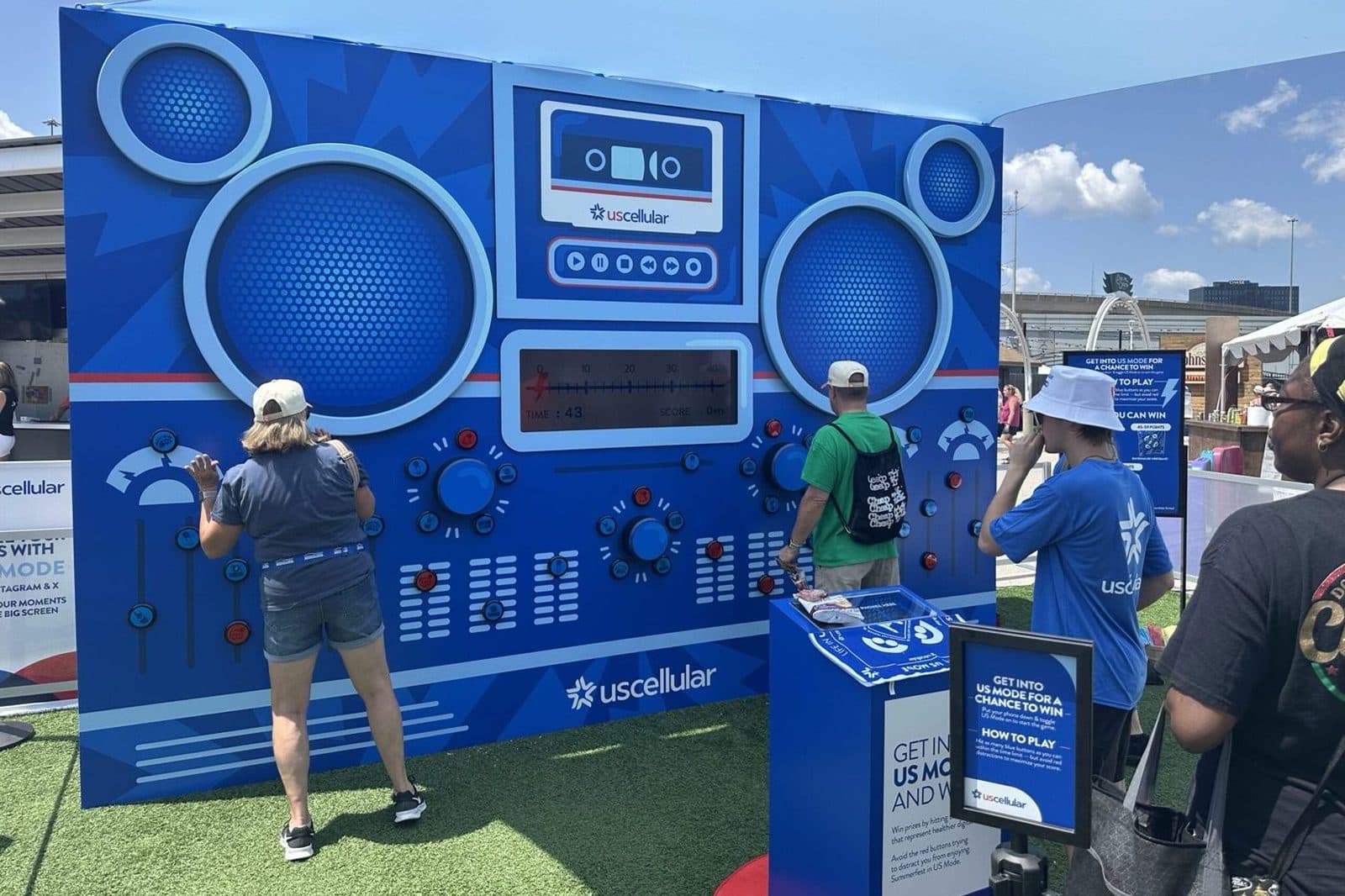 Guests playing the UScellular US Mode boombox wall at Summerfest