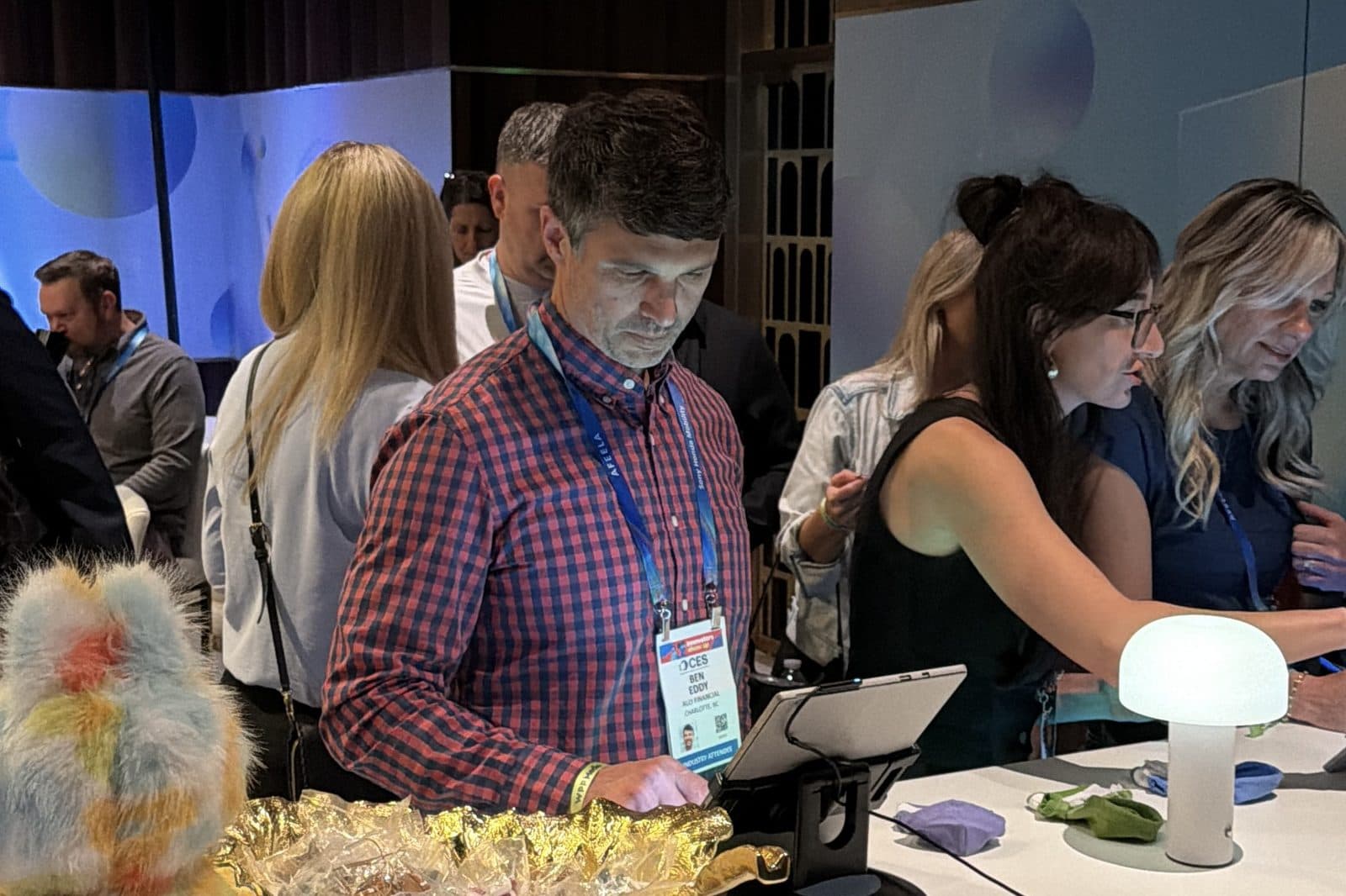 Badged attendees at the WPP Media counter during CES in Las Vegas