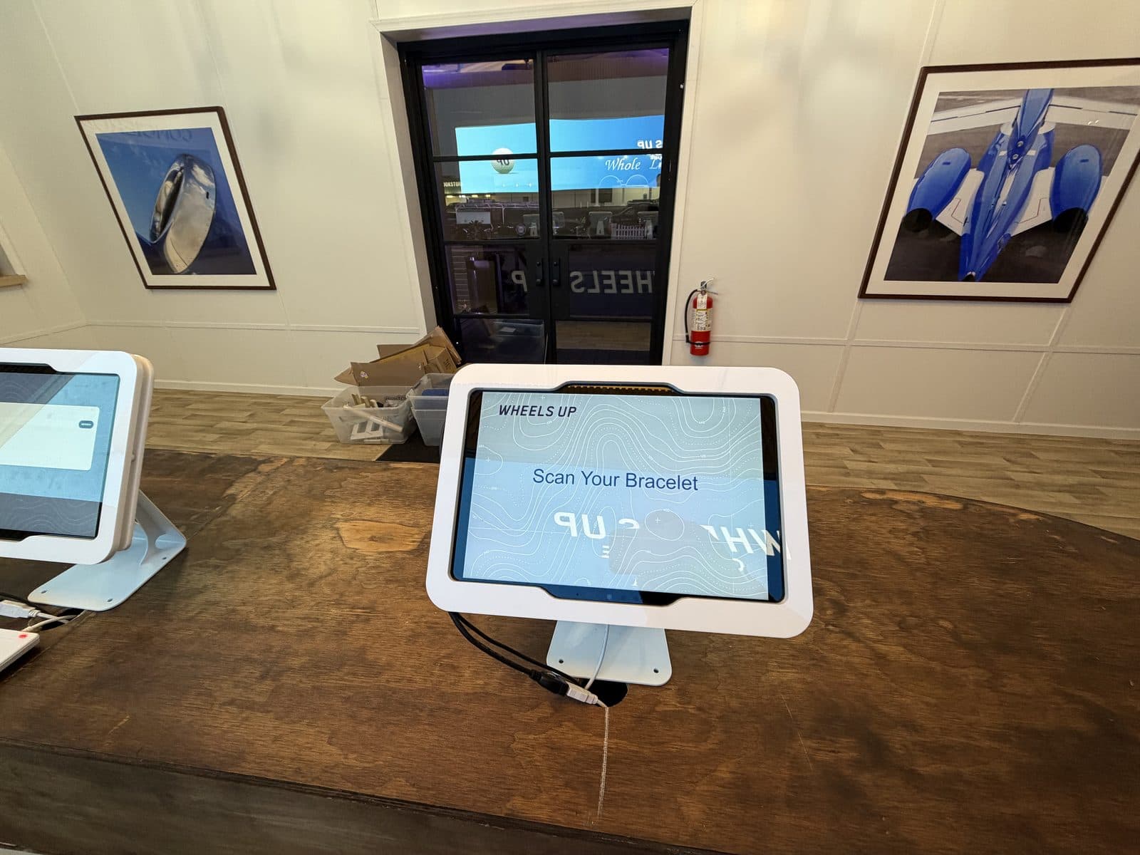 Scan Your Bracelet RFID check-in kiosk on the front desk of the Wheels Up clubhouse at the Masters